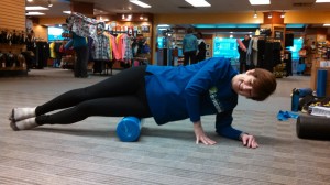 me using a foam roller on my IT band at the FrontRunner clinic.