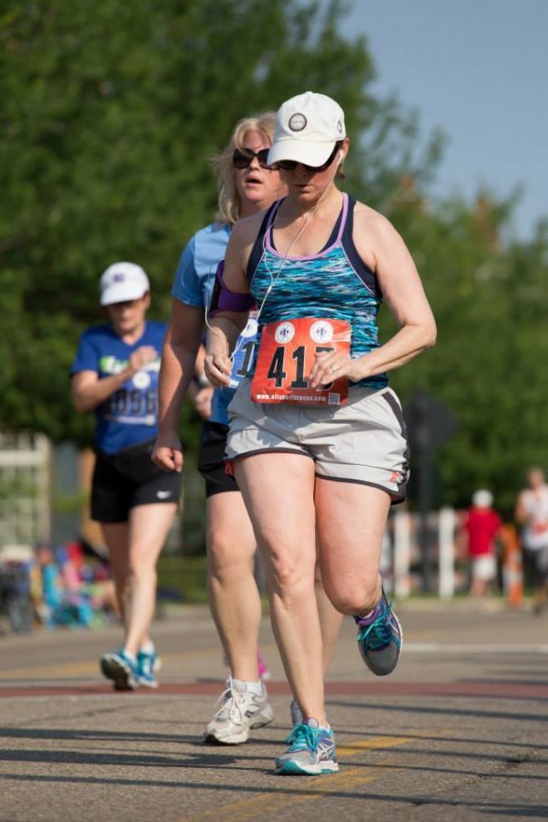 Me at the far left pushing hard to PR in while race walking, speed walking the New Albany Independence 5K.