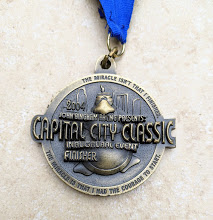 Capital City Half marathon medal from the inaugural Capital City Half Marathon. David Babner is the race director. How to walk a half marathon and how to walk a marathon.