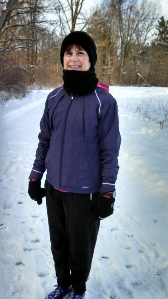 Cindi Leeman of WALK Magazine is wearing winter clothes, layering clothes for walking in the winter.