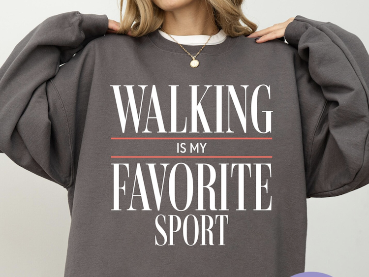 gray sweatshirt with walking slogan