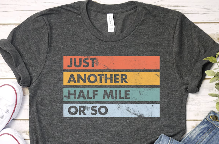 gray shirt with a funny walking slogan