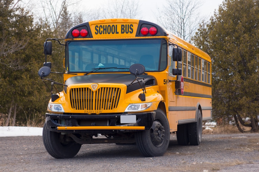 yellow school bus used as a race shuttle