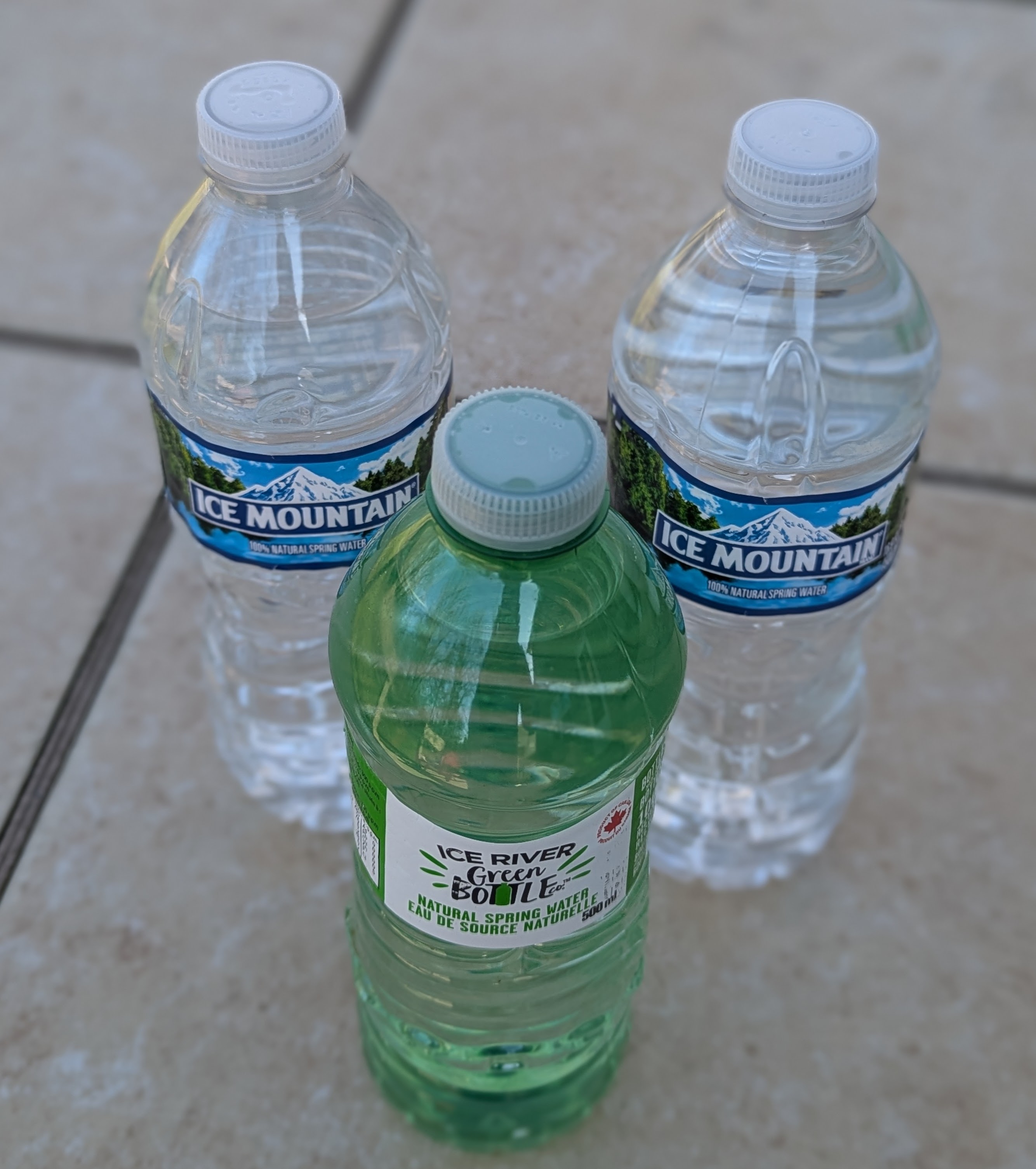 three plastic bottles of water