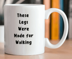 white coffee mug with walking slogan